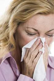 flu - sneezing into a tissue